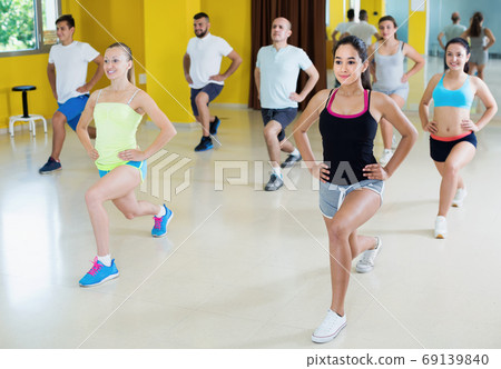 Young energy women and men dancing 69139840