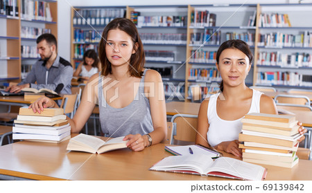 Two attractive girls preparing for exam 69139842
