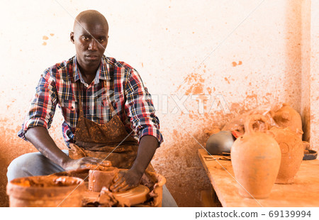 Man making ceramics on pottery wheel Man making ceramics on pottery wheel 69139994