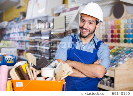 Adult master standing near basket with tools 69140190
