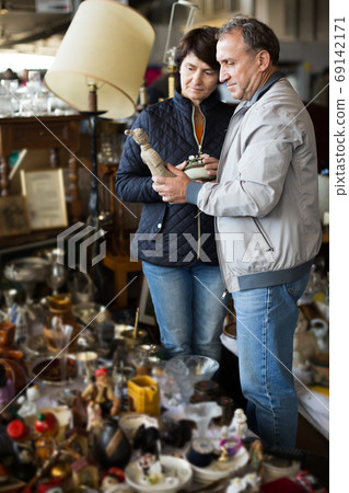 Senior man and female at traditional flea market Senior man and female at traditional flea market 69142171