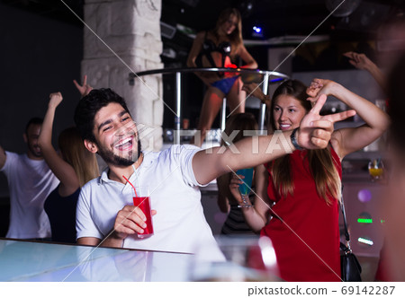 People joying in nightclub People joying in nightclub 69142287