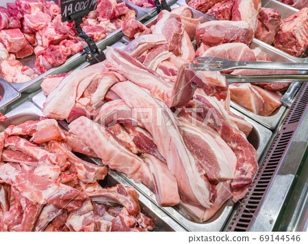 Pile of raw pork chop meat at butchers shop Pile of raw pork chop meat at butchers shop 69144546