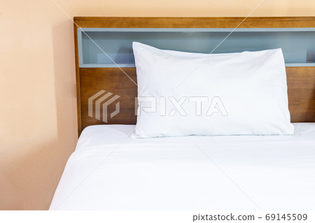White pillows on a bed Comfortable soft pillows on the bed. 69145509