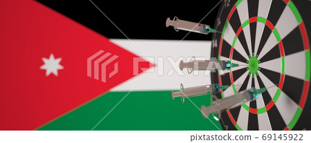 Vaccine syringes with text and flag of Jordan as a background. Jordanian Medical research and vaccination, 3D rendering Vaccine syringes with text and flag of Jordan as a background. Jordanian Medical research and vaccination, 3D rendering 69145922