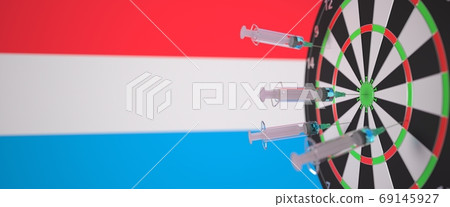 Vaccine syringes with text and flag of Luxembourg as a background. Luxembourgian Medical research and vaccination, 3D rendering Vaccine syringes with text and flag of Luxembourg as a background. Luxembourgian Medical research and vaccination, 3D rendering 69145927