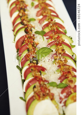 Tomato and avocado caprese Tomato and avocado caprese 69146724