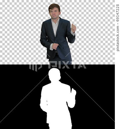 Arrogant businessman in a suit dancing, Alpha Channel Arrogant businessman in a suit dancing, Alpha Channel 69147228