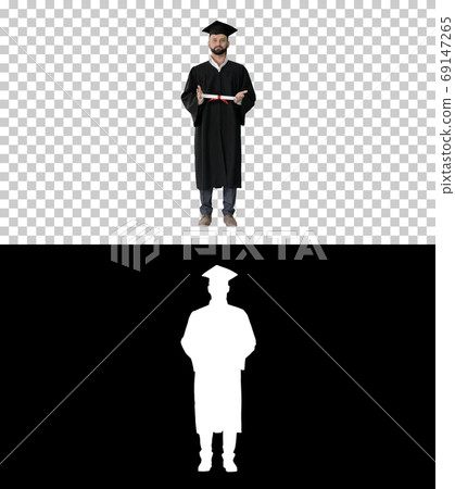 Male student graduate showing diploma, Alpha Channel Male student graduate showing diploma, Alpha Channel 69147265