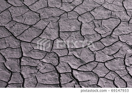 Dried and cracked land in the dry season. natural background and Dried and cracked land in the dry season. natural background and 69147933