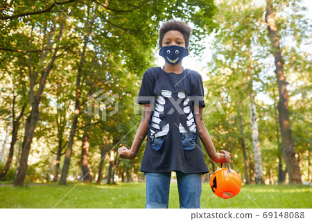 Boy at Halloween party 69148088