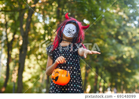 Spooky little girl outdoors 69148099