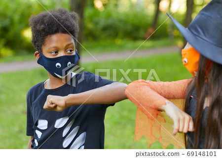 Boy and girl playing outdoors 69148101