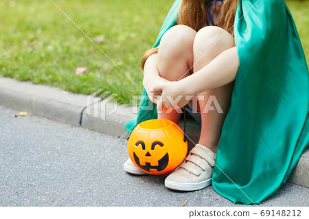 Girl with basket for sweets 69148212
