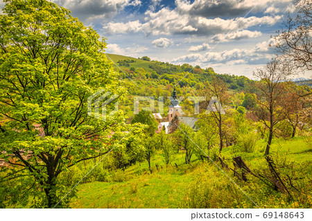 Church in Lednica village on a spring sunny day, Slovakia. Church in Lednica village on a spring sunny day, Slovakia. 69148643
