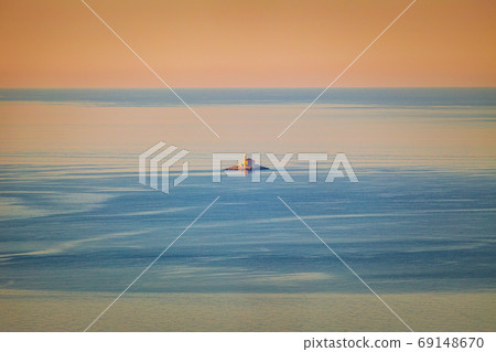 A lonely small island with a church. A lonely small island with a church. 69148670