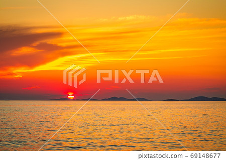 Sea landscape at sunset from Primosten town. Sea landscape at sunset from Primosten town. 69148677