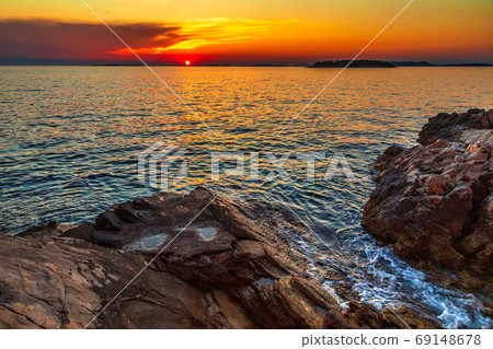 Sea landscape at sunset from Primosten town. Sea landscape at sunset from Primosten town. 69148678