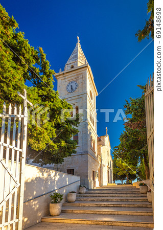 Bell tower of St George Church in Primosten town. Bell tower of St George Church in Primosten town. 69148698