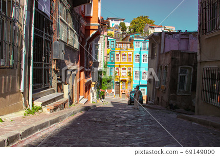 woman at colorful buildings in Balat in Istanbul 69149000