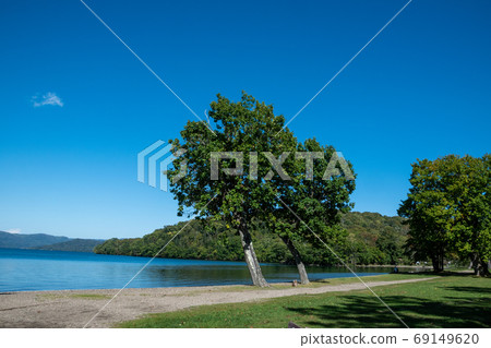 Lake Kussharo, a quiet blue lake and trees by the lake 69149620