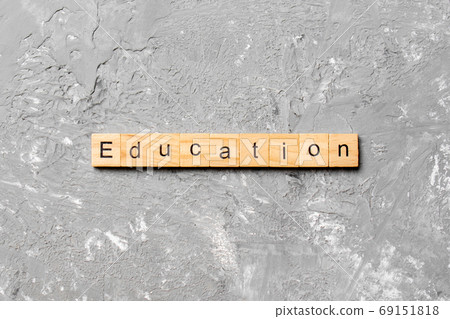 Education word written on wood block. Education text on cement table for your desing, concept 69151818