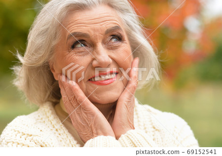 Close up portrait of happy senior woman smiling Close up portrait of happy senior woman smiling 69152541