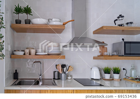 Modern kitchen interior with white brick tile wall in Scandinavian style 69153436