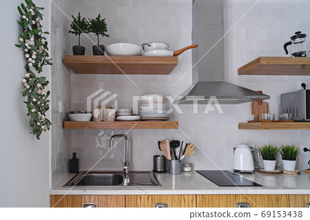 Modern kitchen interior with white brick tile wall in Scandinavian style Modern kitchen interior with white brick tile wall in Scandinavian style 69153438