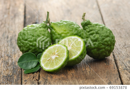 Bergamot isolated on wooden blackground 69153878