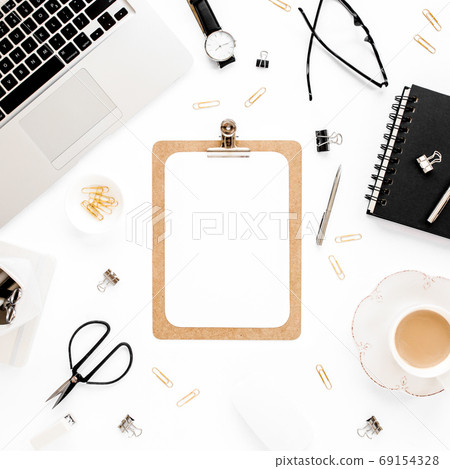 Home office workspace mockup with laptop, clipboard, notebook and accessories on white background. Flat lay, top view 69154328