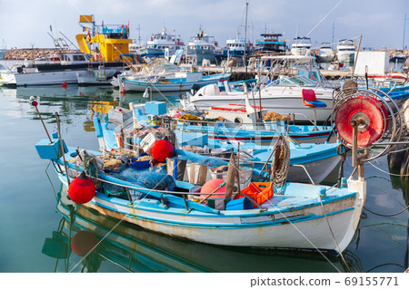 Small Greek fishing boats are moored in Ayia Napa 69155771