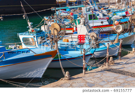 Small Greek fishing boats are moored in Ayia Napa 69155777