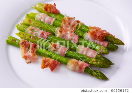 The Asparagus wrapped in bacon. Shallow dof The Asparagus wrapped in bacon. Shallow dof 69156172