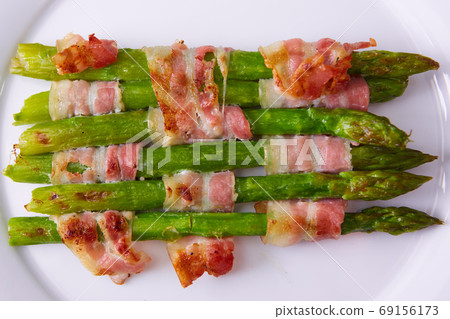 The Asparagus wrapped in bacon. Shallow dof 69156173