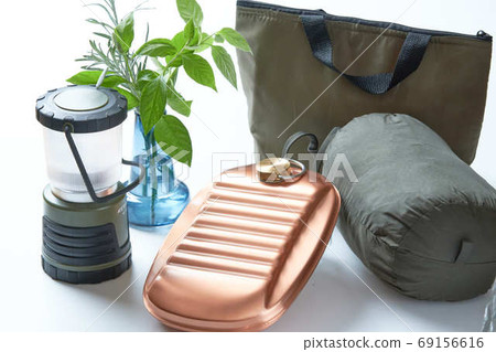 An orange copper hot water bottle perfect for winter camps 69156616
