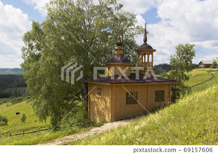 Chapel in Russian village. Chapel of the Assumption of the Mother of God in the village Markovskaya, Verhovazhskogo district, Vologda region Chapel in Russian village. Chapel of the Assumption of the Mother of God in the village Markovskaya, Verhovazhskogo district, Vologda region 69157606
