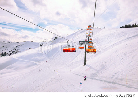 Chair ski lift in Saalbach Hinterglemm, Austria Chair ski lift in Saalbach Hinterglemm, Austria 69157627