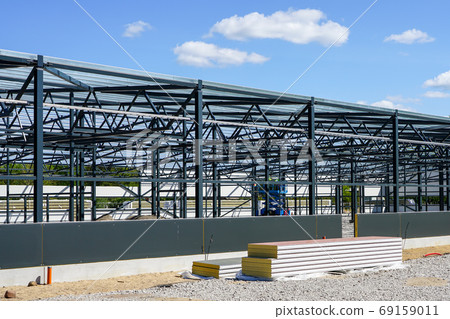 construction of a new modern industrial building, metal truss frame construction of a new modern industrial building, metal truss frame 69159011