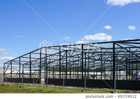 construction of a new modern industrial building, metal truss frame construction of a new modern industrial building, metal truss frame 69159012