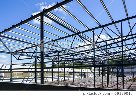construction of a new modern industrial building, metal truss frame construction of a new modern industrial building, metal truss frame 69159013