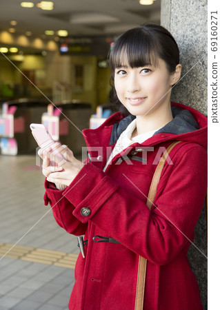 Woman meeting at the station Woman meeting at the station 69160271