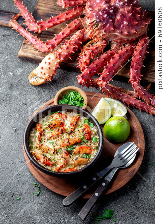 Chilean food. Baked crabmeat crab meat with cheese, cream and bread. Pastel o chupe de sentolla or king crab Chilean food. Baked crabmeat crab meat with cheese, cream and bread. Pastel o chupe de sentolla or king crab 69160608