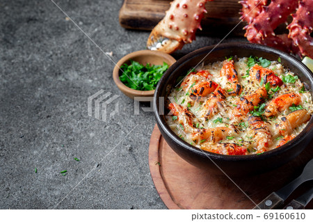 Chilean food. Baked crabmeat crab meat with cheese, cream and bread. Pastel o chupe de sentolla or king crab Chilean food. Baked crabmeat crab meat with cheese, cream and bread. Pastel o chupe de sentolla or king crab 69160610