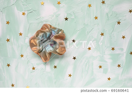 Trendy holographic scrunchie and stars on green Trendy holographic scrunchie and stars on green 69160641