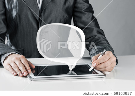 Female hands using graphics tablet and glass icons fly in air. Mixed media Female hands using graphics tablet and glass icons fly in air. Mixed media 69163937
