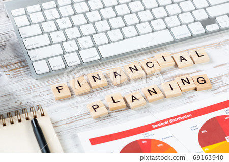 Financial planning concept with letters on cubes Financial planning concept with letters on cubes 69163940
