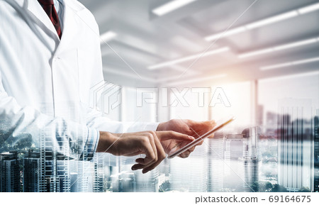 Medical industry concept by means of successful doctor Medical industry concept by means of successful doctor 69164675