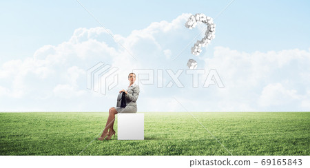 Attractive business lady or accountant outdoors on white box 69165843