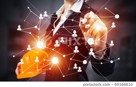 Businesswoman with abstract social network Businesswoman with abstract social network 69166610